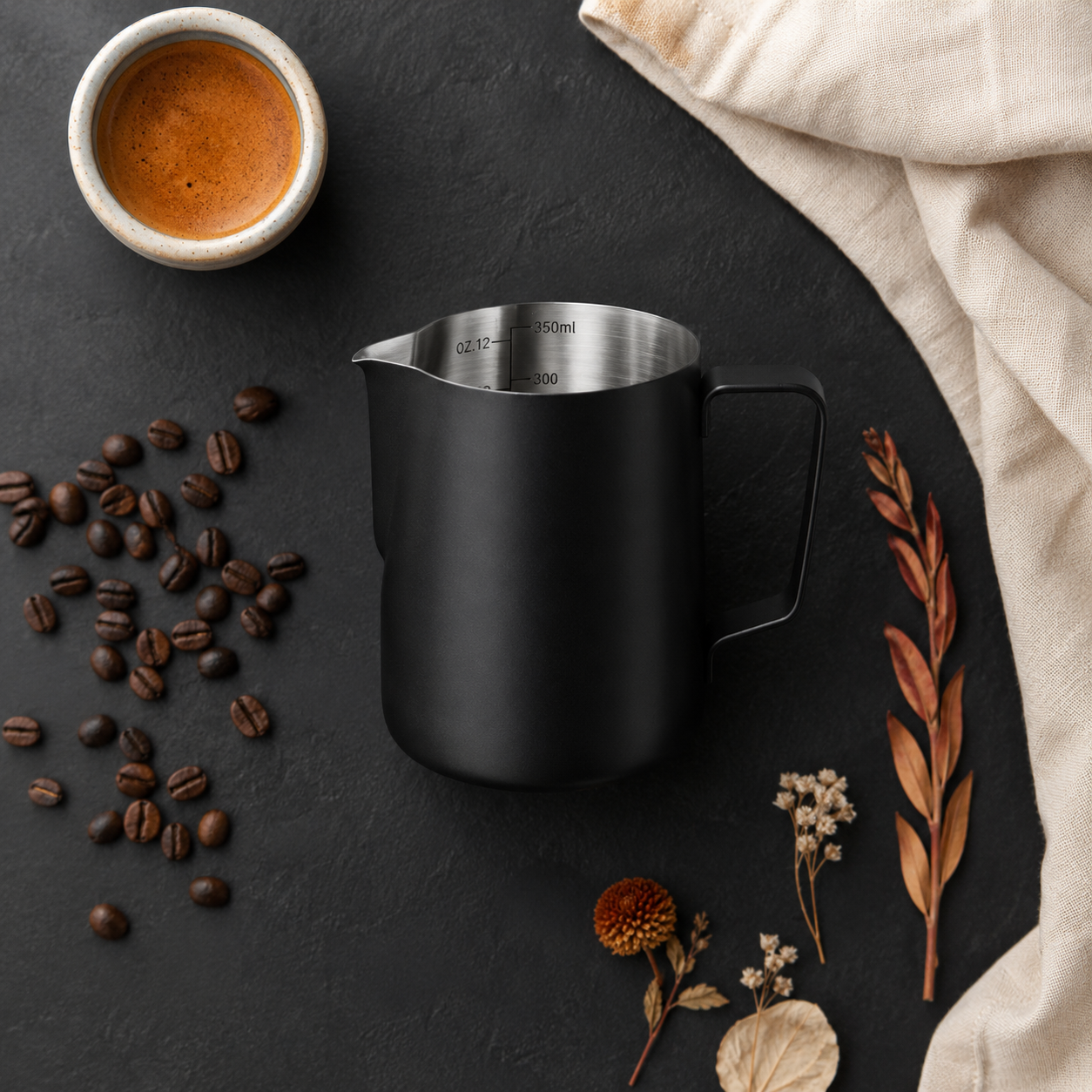 ElyseraRitual black milk pitcher 350ml flat lay with espresso cup and coffee accessories on ivory linen